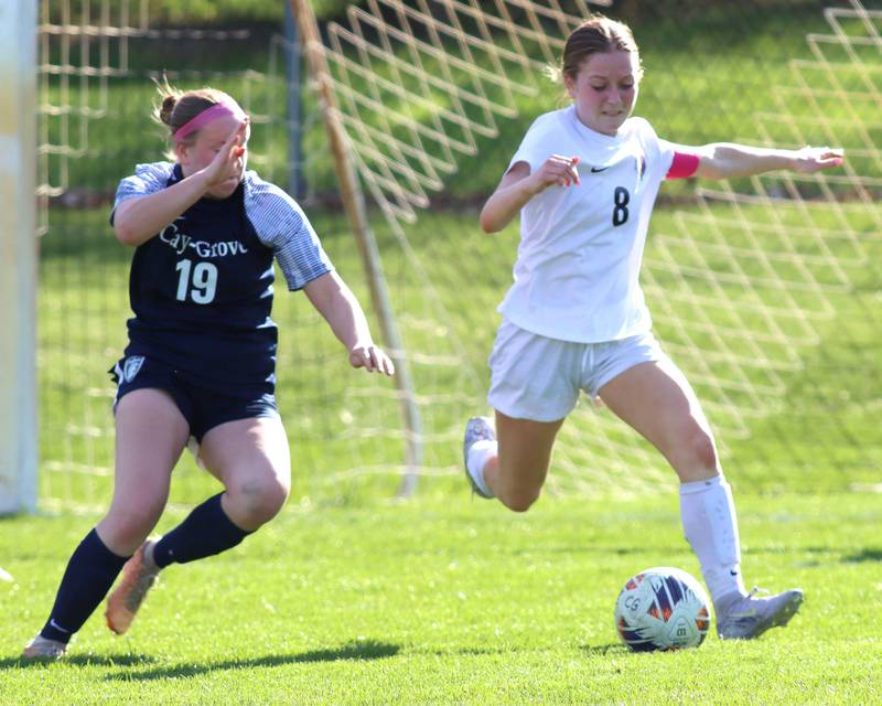 Prairie Ridge’s Sierra Greenwell, right, moves the ball  in varsity girls soccer at Cary-Grove High School in Cary on Tuesday, April 29, 2025.