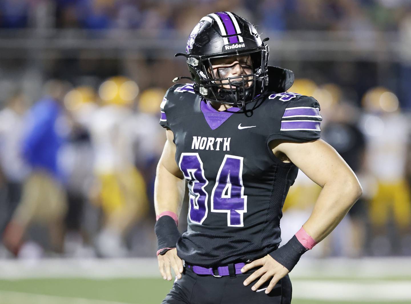Downers Grove North's Jake Gregorio (34) looks to the sideline for a play during the varsity football game between Downers Grove North and Lyons Township on Friday, Oct. 11, 2024 in Downers Grove.