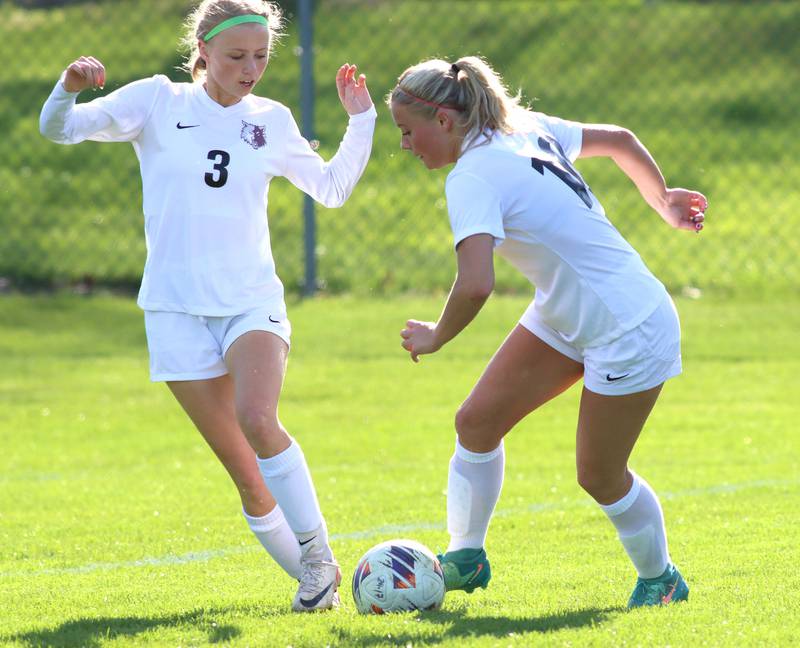 Prairie Ridge’s Maria Falkowska, right, and Carrie Sosnowski control the ball  in varsity girls soccer at Cary-Grove High School in Cary on Tuesday, April 29, 2025.