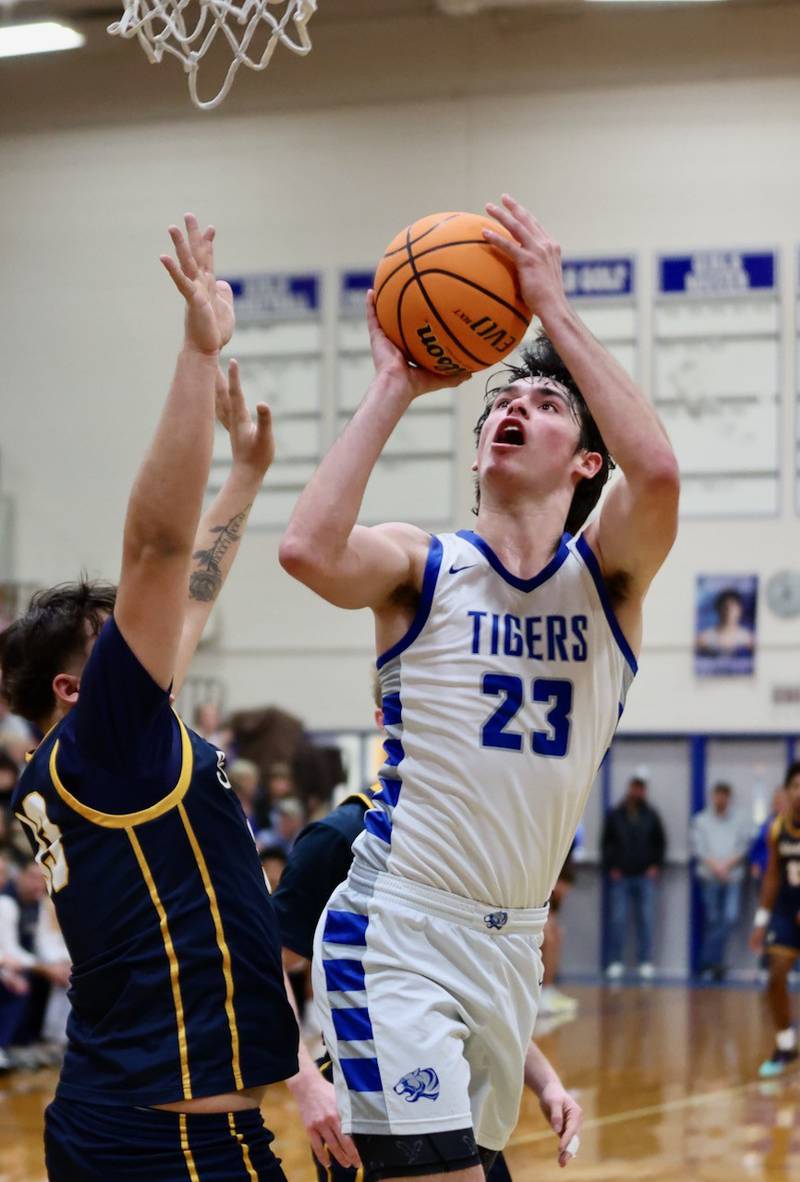 Princeton's Noah LaPorte shoots over Sterling's Maddux Osborn Friday night at Prouty Gym. The Tigers won 56-47.