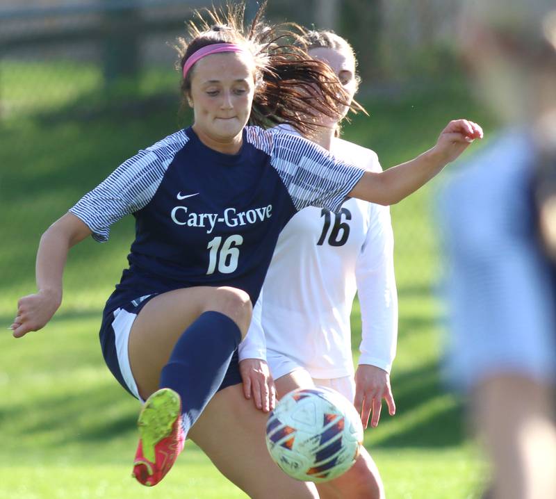 Cary-Grove’s  Sam Skerl, front, manages the ball ahead of Prairie Ridge’s Emily McPherson in varsity girls soccer at Cary-Grove High School in Cary on Tuesday, April 29, 2025.